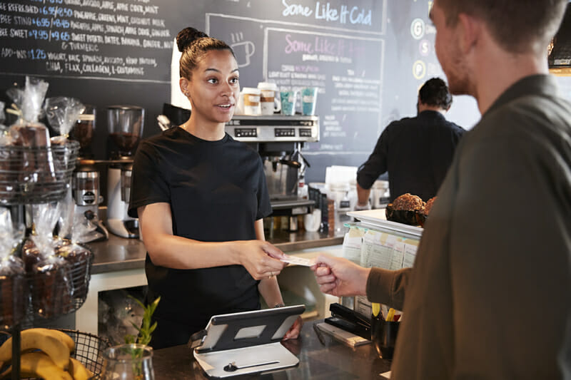 Paying with credit card at coffee shop