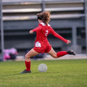 Adult woman playing soccer